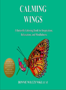 Book cover of 'Wings' featuring a colorful butterfly illustration.